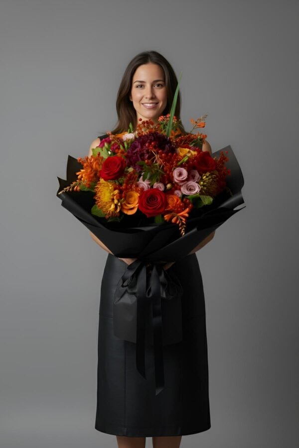 Autumn Colors Bouquet featuring red roses, orange roses, deep purple hydrangeas, chrysanthemums, and bold red berries, delivered same day in London by The London Bloom.