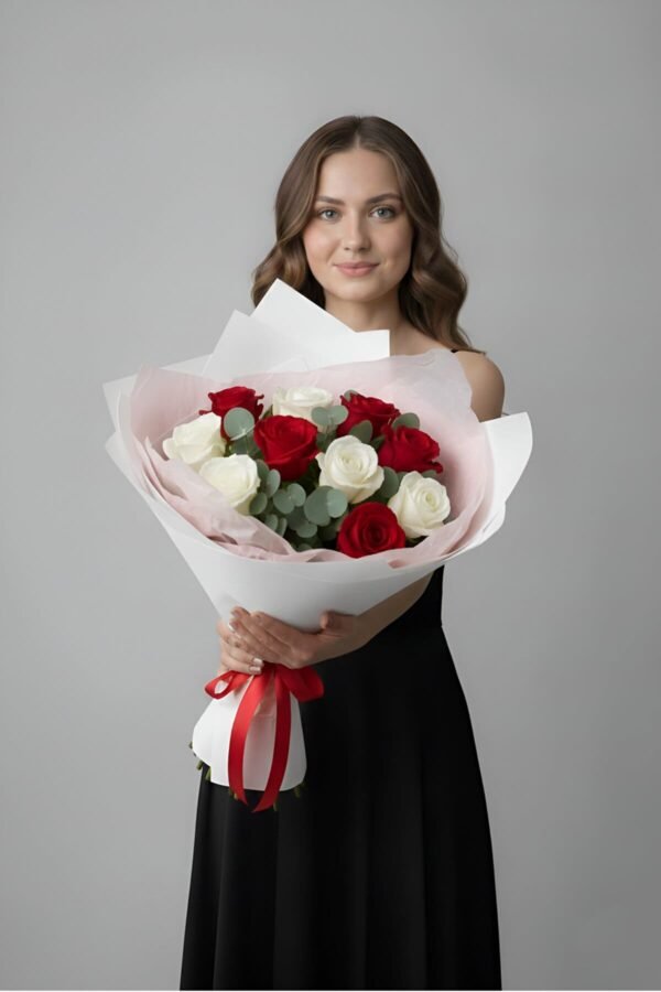 Classic Harmony Bouquet featuring 5 passionate red roses, 5 pristine white roses, and aromatic eucalyptus, presented in a crisp white wrap, delivered same day in London by The London Bloom.