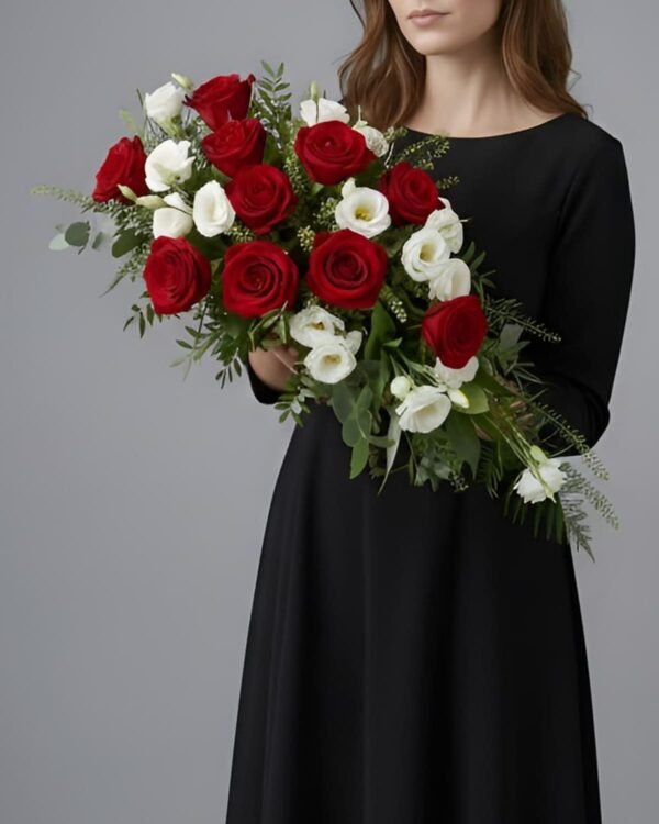 Elegant Eustoma and Rose Casket Spray by The London Bloom featuring deep red roses, white eustoma, and fresh greenery.