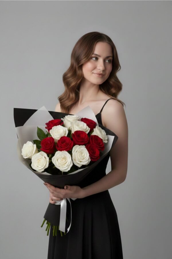 Signature Contrast Bouquet featuring 7 passionate red roses and 8 pristine white roses, presented in chic black and white wrapping, delivered same day in London by The London Bloom.