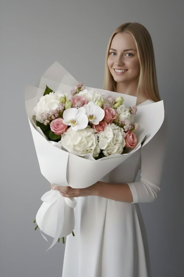 Timeless Romance Bouquet featuring white hydrangeas, dusty pink roses, white cymbidium orchids, and wax flower, delivered same day in London by The London Bloom.