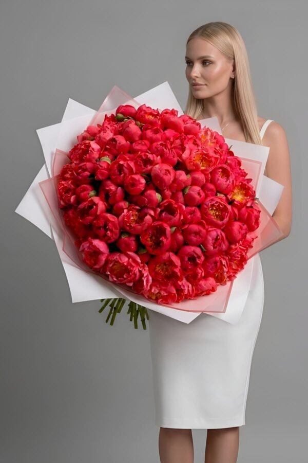 A large bouquet containing 100 peony Coral Sunset arranged in a dense, uniform bunch by The London Bloom.